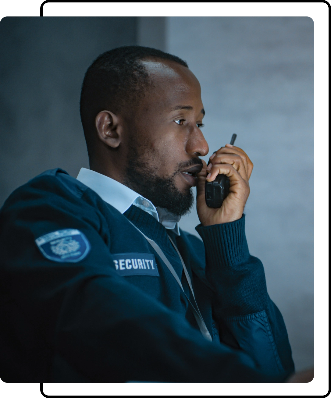 A security guard talking on the phone