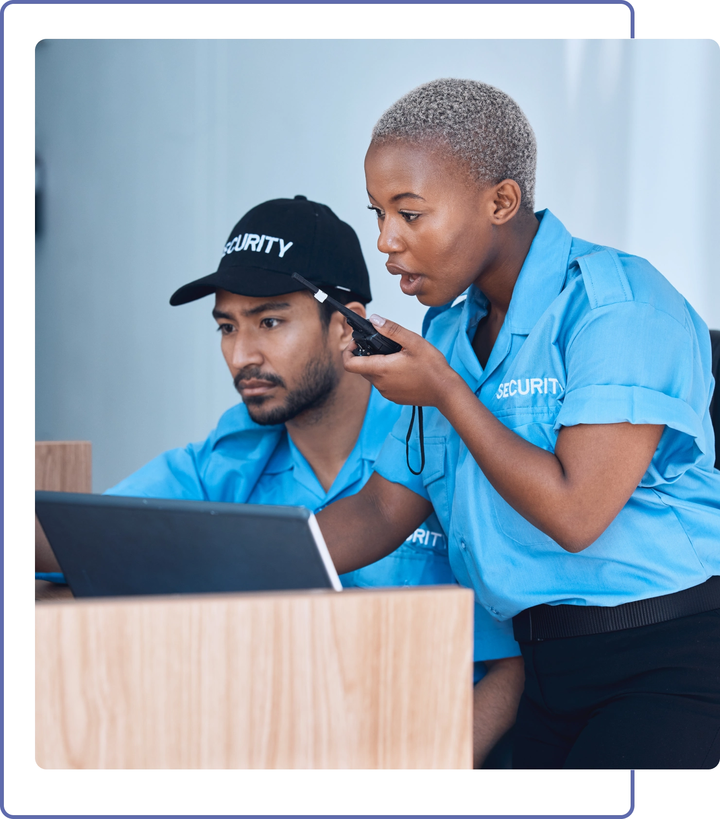 Two people looking at a laptop screen